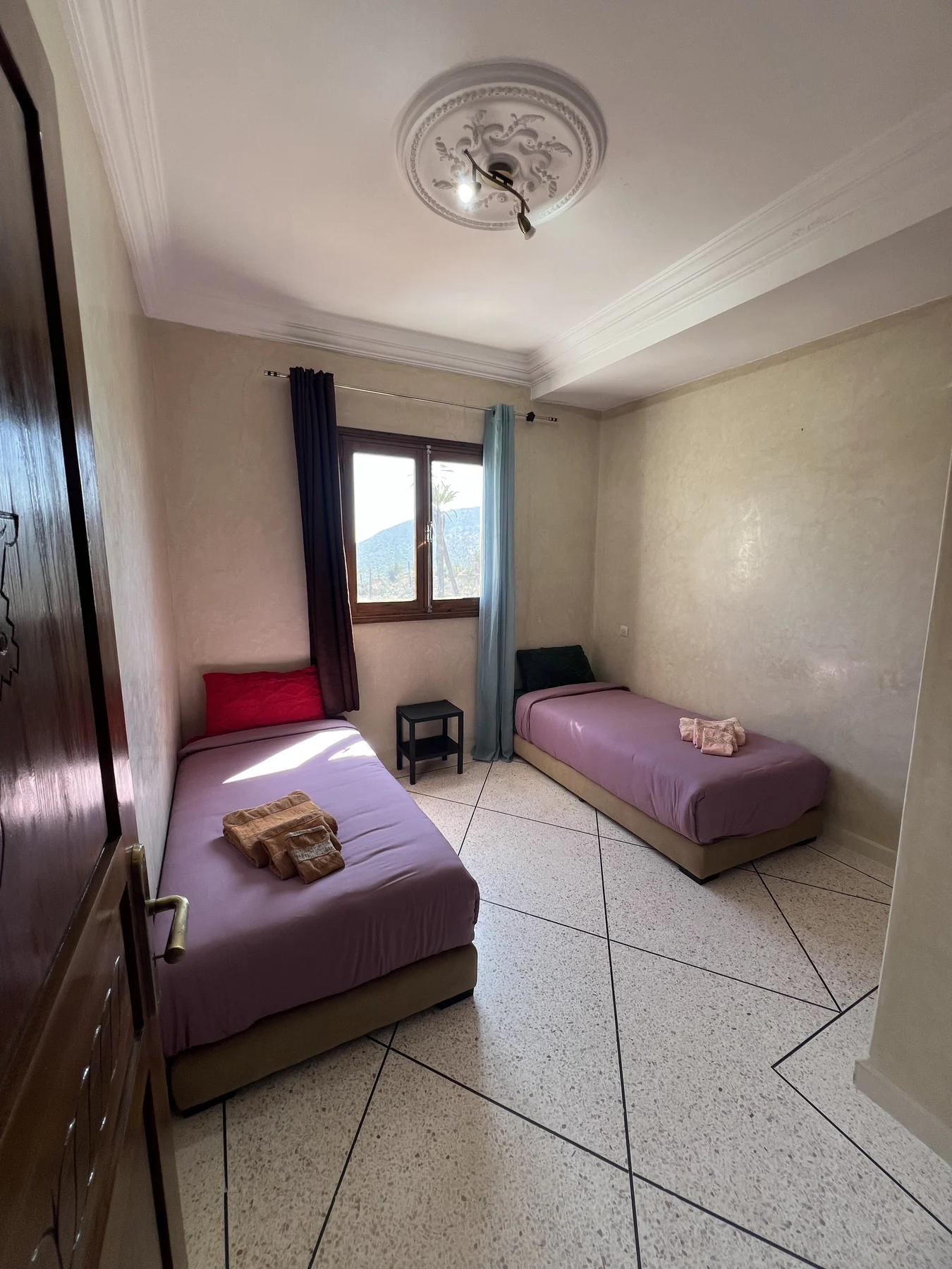 Twin room with mauve beds
